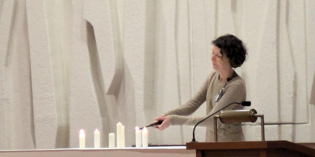 Woman lighting seven candles