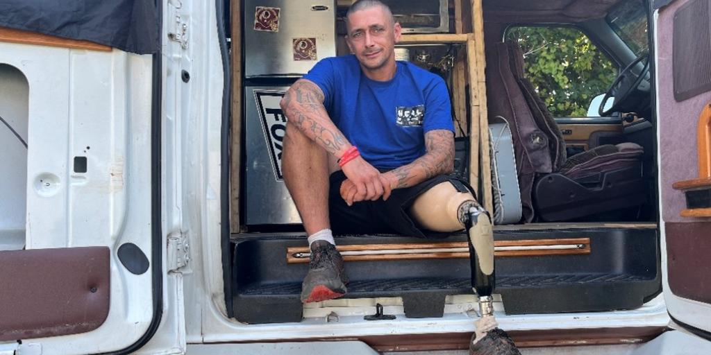 U.S. Army Veteran David Riggins poses for a photograph in the HEAL Wagon.