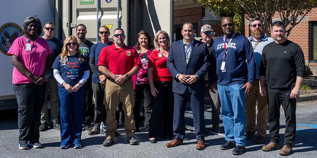 Members of the Columbia VA HCS Pentad, and employees of the Spartanburg CBOC and support staff pose for a photo in front of the Spartanburg C-Forts.