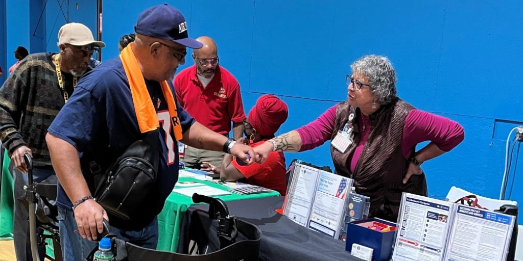 VA employee provides VA information to a Veteran.