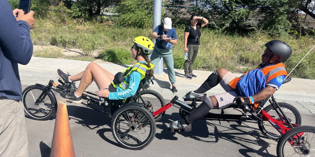 Participants in the cycling competition crossing the finish line at the final day of the Koa Challenge Veteran Games, 2024. 