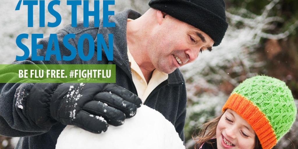 Veteran and daughter build a snow man. Tis the season to be flu free. Fight Flu, get your flu shot