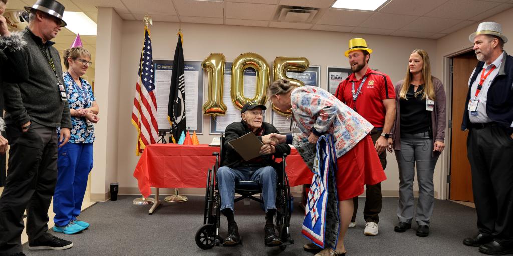 Wayne Perry, a World War II Veteran, is celebrated for his 105th birthday at the Cleveland VA clinic.