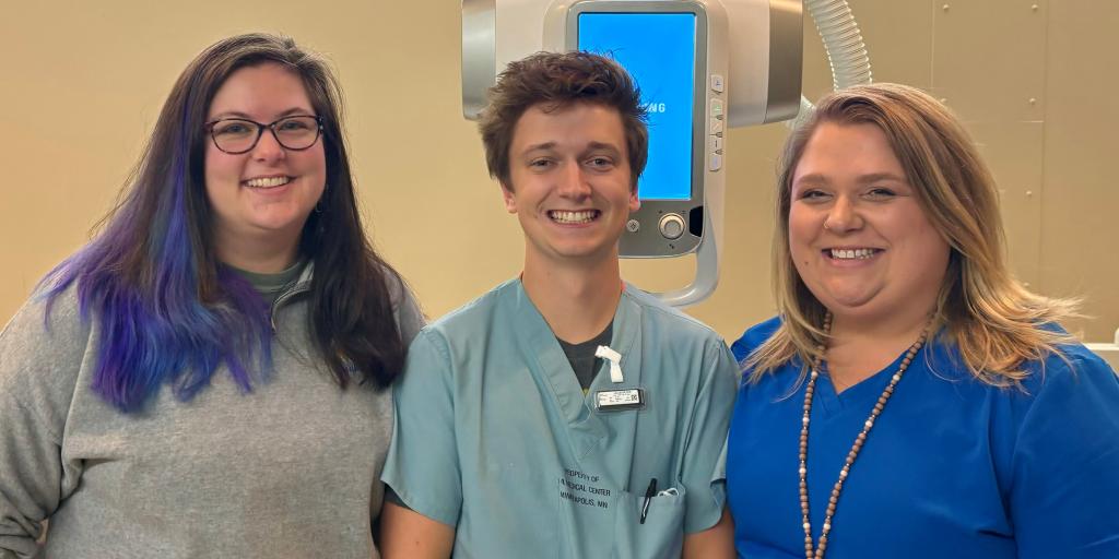 School of radiologic technology program officials pose with a recent graduate