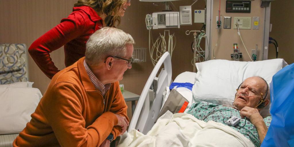 Blake Wahlen talks to a Veteran at the George E. Wahlen Medical Center