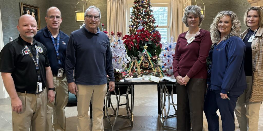 Fisher House and North Florida Hospital Teams with the donated holiday trees.