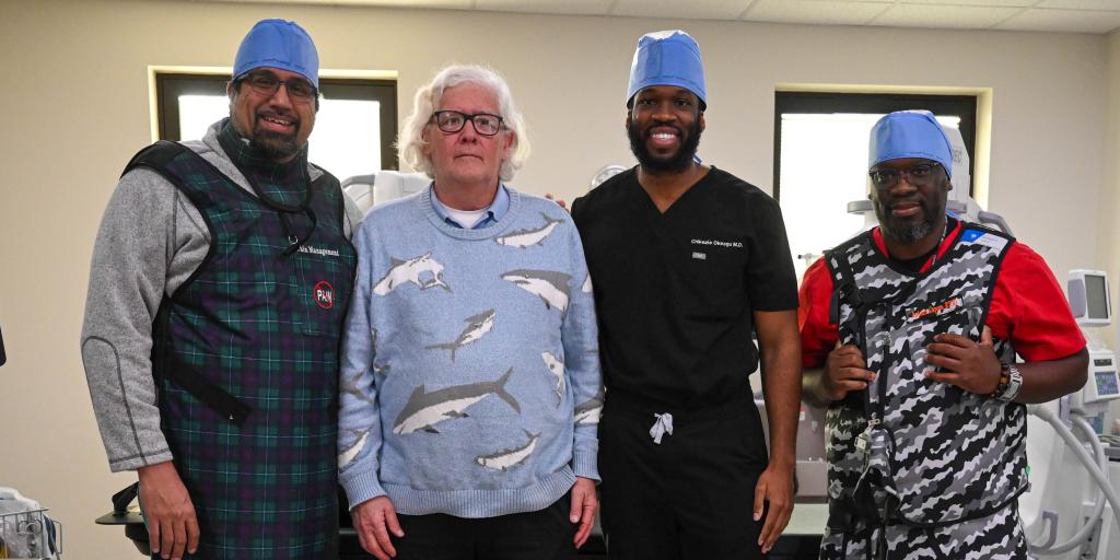 Drs. Yusef Sayeed, Michael Getter, Chikezie Okeagu, & Diagnostic Radiologic Technologist, Antonio Capers, pose for a photo in Dorn VAMC's Pain Suite. 