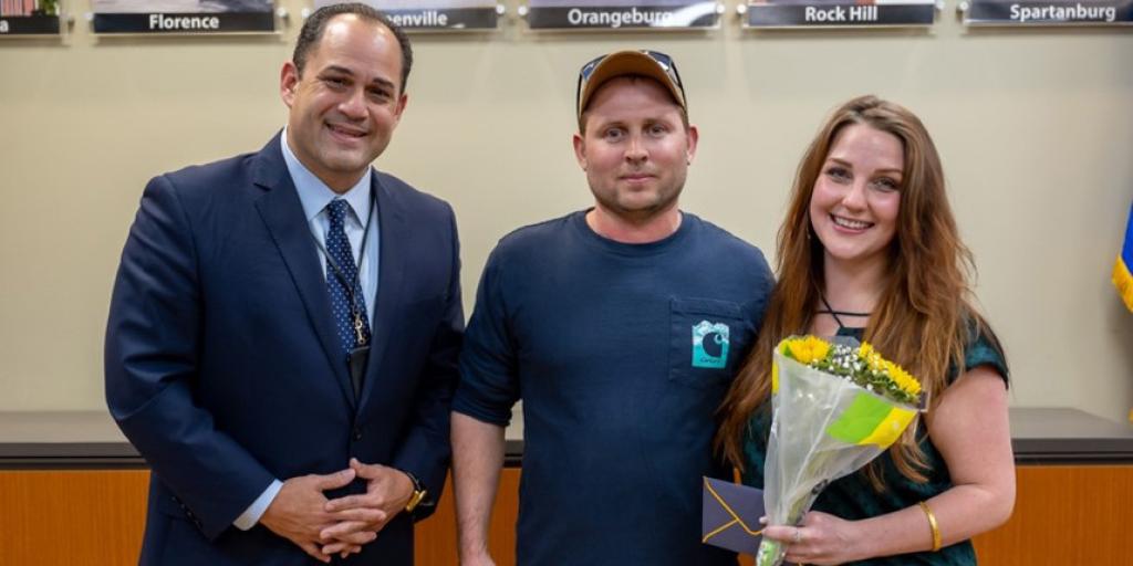 Oscar G. Rodriguez, Eric Anselmo, and Ashley Crone pose for a photo.