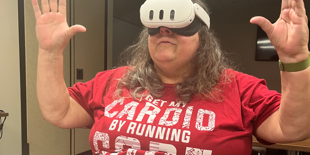 A Veteran experiences the  Innerworld metaverse-enabled peer social support platform using a VR headset.