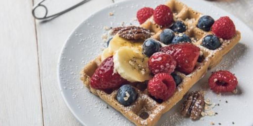 Oatmeal Pecan Waffles with fruit on top