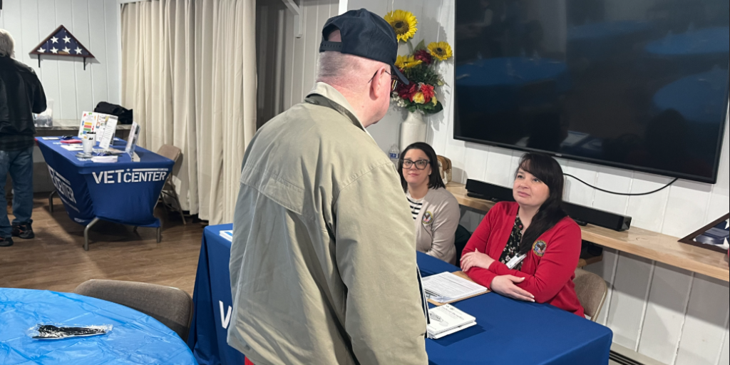 VA Providence staff Trisha Cote and Michelle Henderson speak to a Veteran during the event.