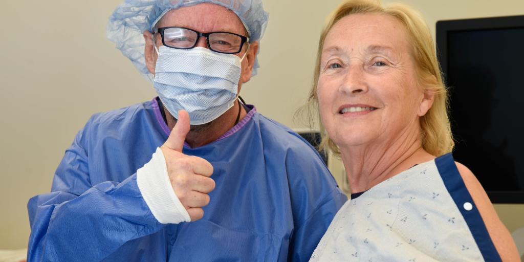 Dr. Foreman and Patient smiling and giving a thumbs up after procedure.