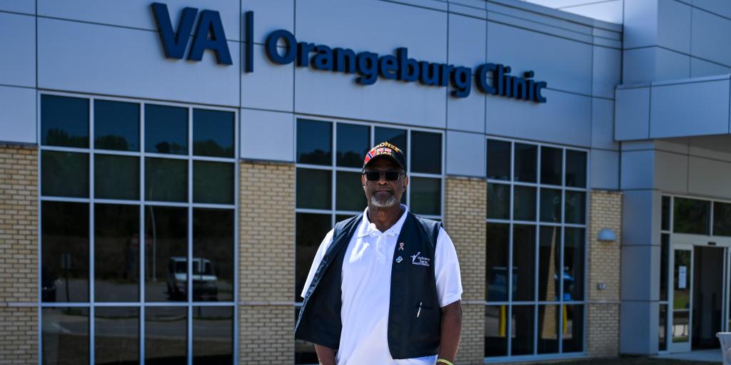 Jerry Sims poses in front of Orangeburg CBOC