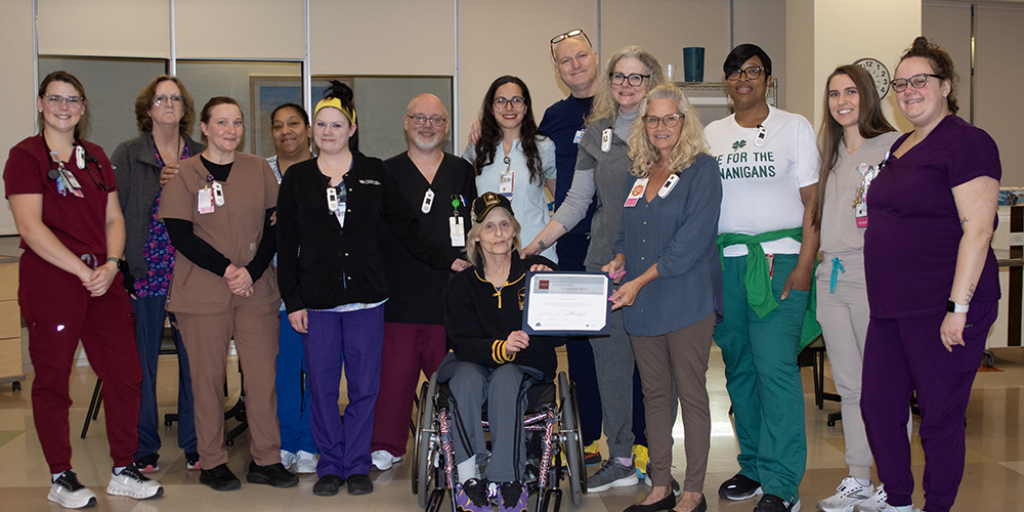 Kimberly Walters with Syracuse VA Medical Center Spinal Cord Injury staff.