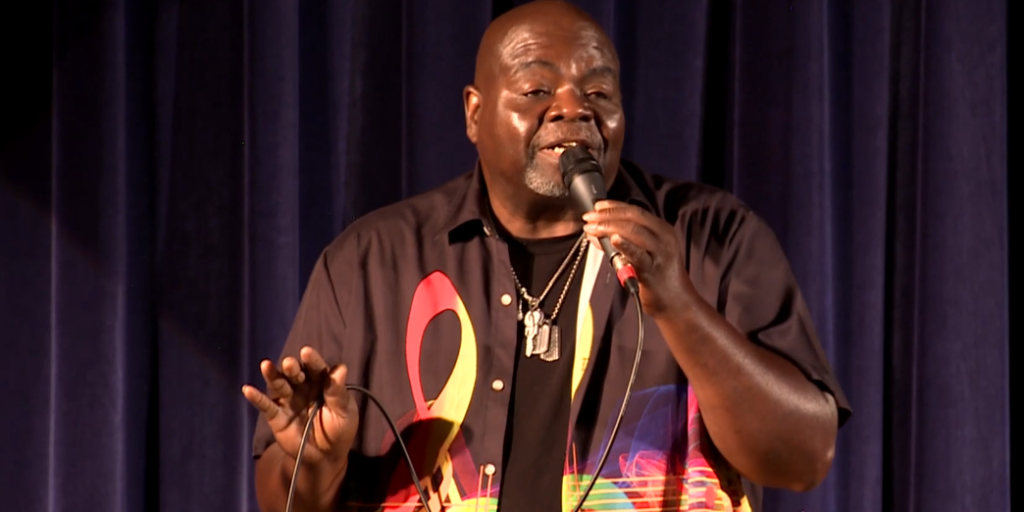Man holding microphone and singing