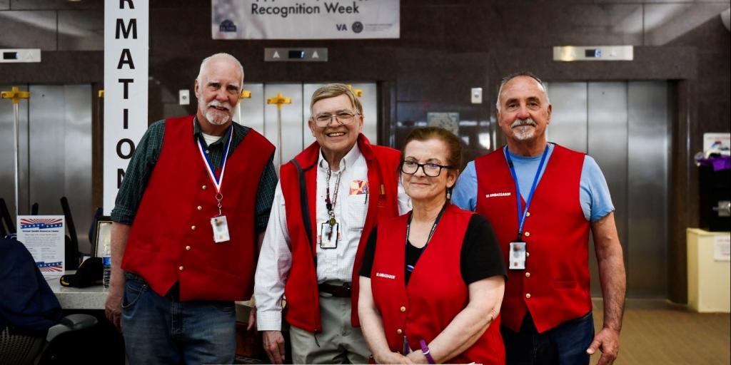 L-R: Charles Freestone, Dr. William Cristo, Marie Casey and Robert Macclary volunteer at the info desk at the West Roxbury VA campus, April 23, 2025.