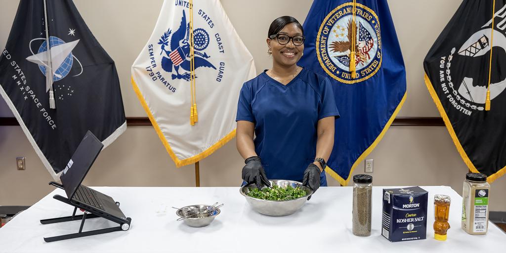 employee preparing kale salad