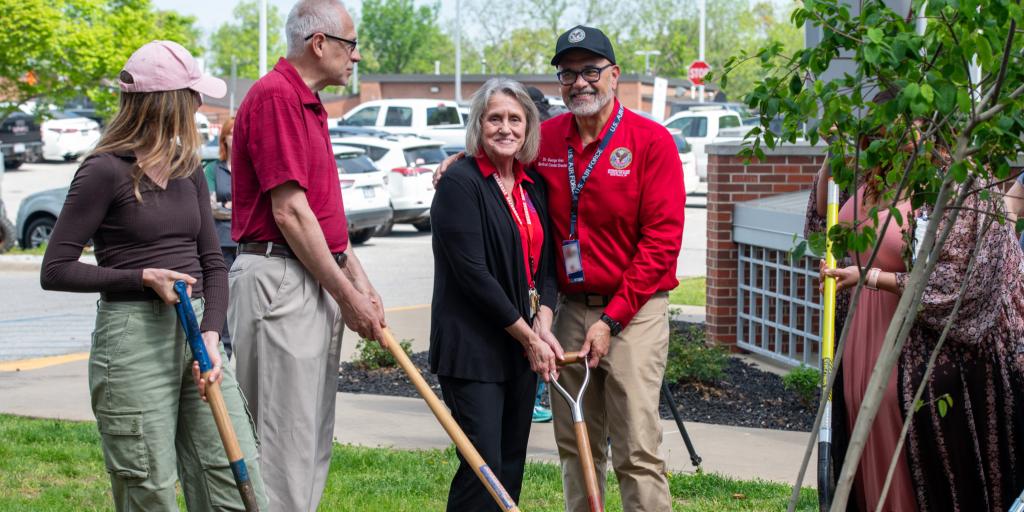 Veterans, Staff and Community members planting a tree