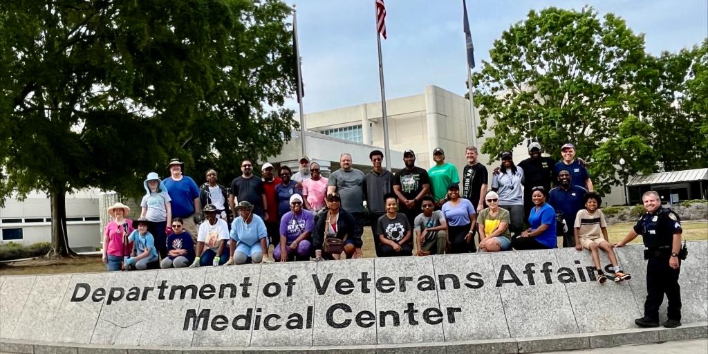Group photo in front of Uptown VA main entrance