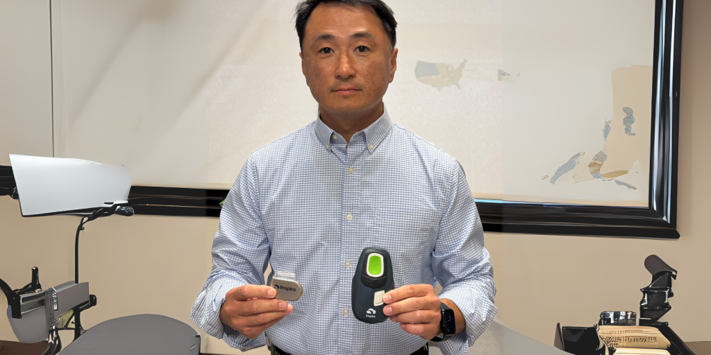 Dr. Jason Hahn displays the Inspire device (left) as well as the remote that patients use to turn on the device before they go to sleep.
