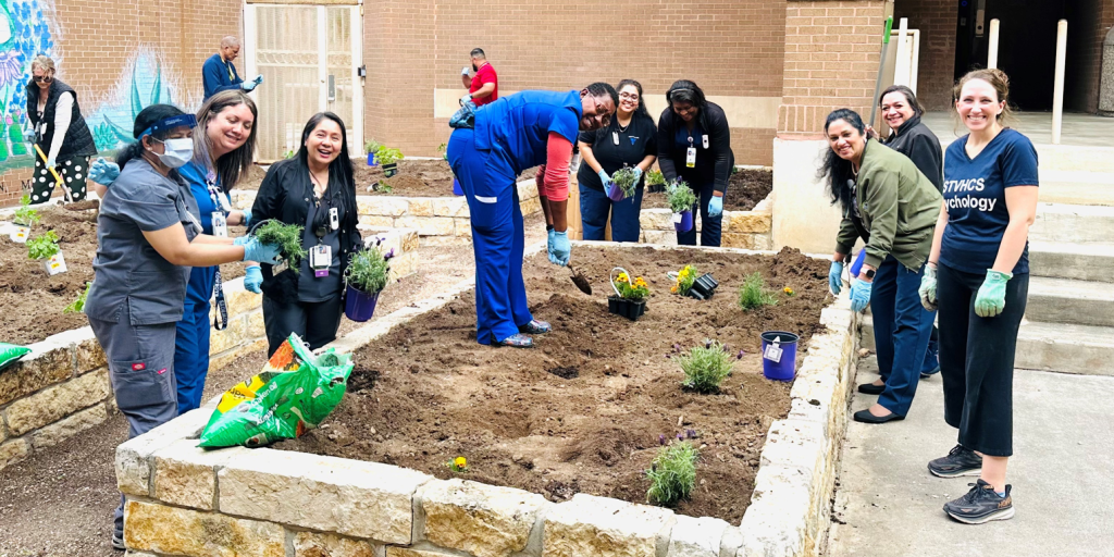 VA staff planting a garden