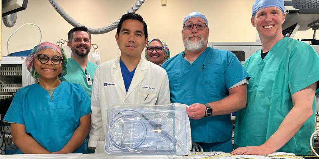 The Durham VA Electrophysiology Team poses for a group photo with an example of the VARIPULSE catheter. 