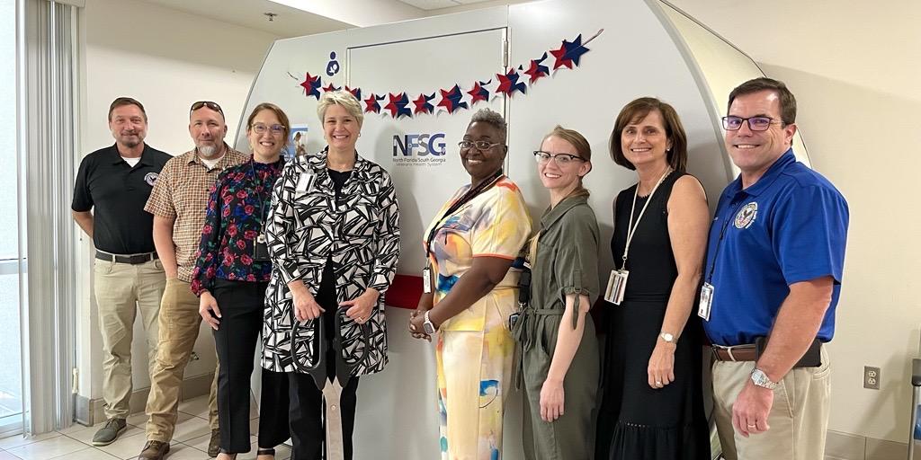The Executive Leadership Team, along with the Innovation Specialist and representatives from the Women Veterans Program, gathered for a photo.