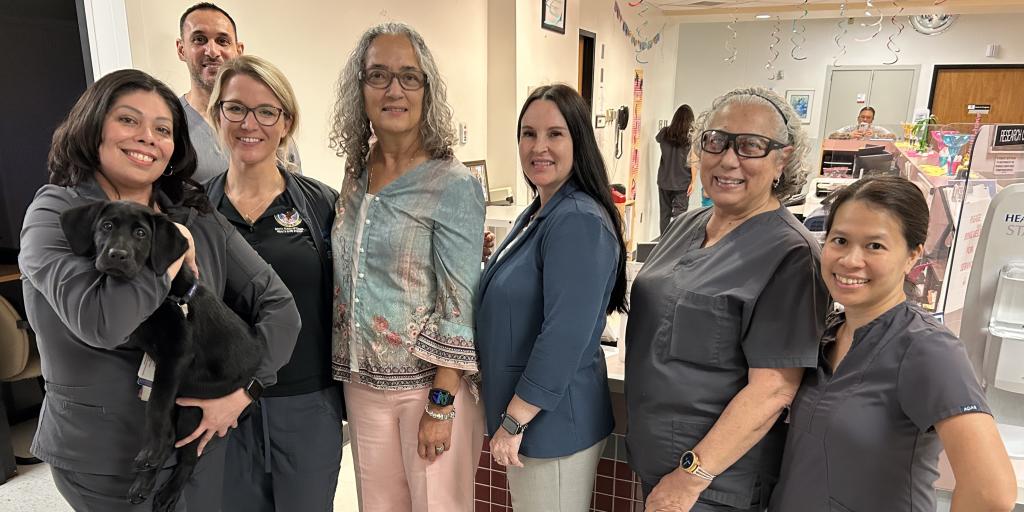 Dr. Milo posing with Nightingale and the nurses of 7A Bartter Clinical Research Unit (BCRU); Million Veteran Program.
