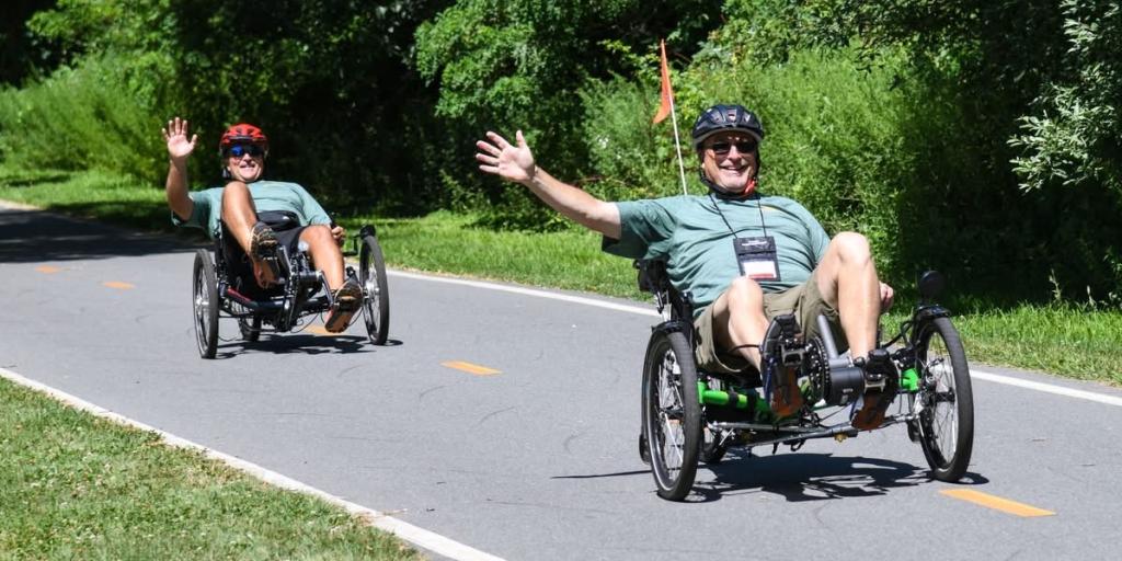Veterans participate in the cycling portion of the VA New England Summer Sports Clinic on the East Bay Bike Path in Barrington, Rhode Island.