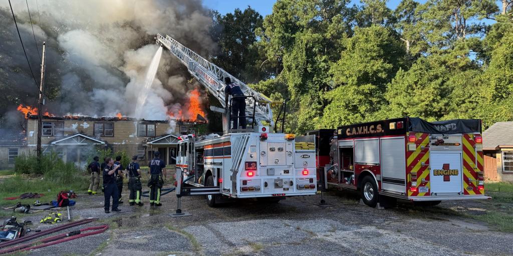 Firefighters from the CAVHCS work alongside Tuskegee Fire Department crews to battle a residential fire on July 28 in Tuskegee, Alabama.