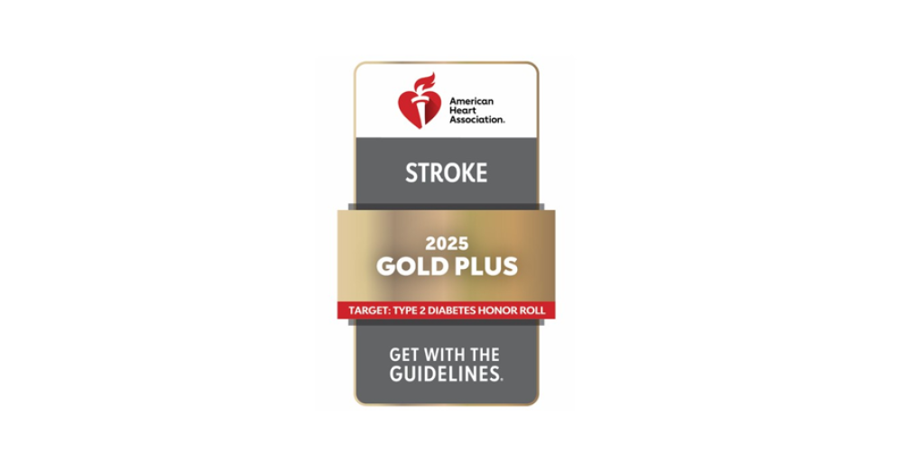 Vertical, rectangular shaped sign or card.  Gray and white background with gold banner.  Symbol of the heart for the American Heart Association.