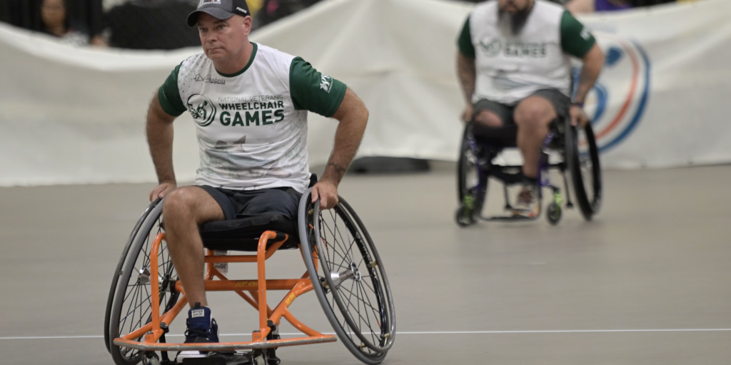 Jason Long and teammate playing in softball game