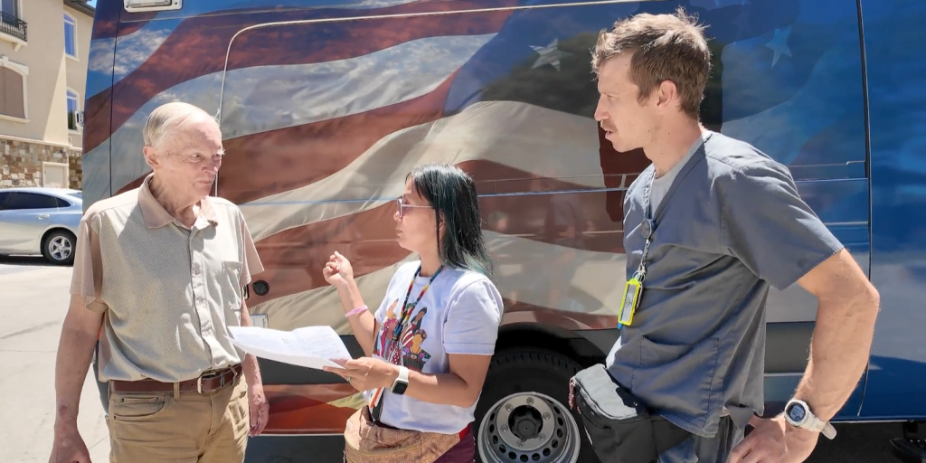 Navy Veteran Tom Morrison, nurse practitioner Alissa Firmage and registered nurse Nathan Borgenicht outside VA Salt Lake City’s mobile medical unit.