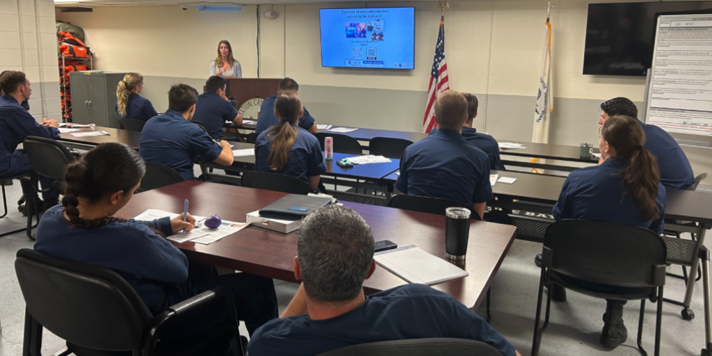 VA Providence's Kim Ferrante speaks to members of the United States Coast Guard about VA Providence services.