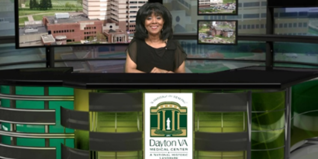 Rhonda Moore, Public Affairs Officer, sitting at desk