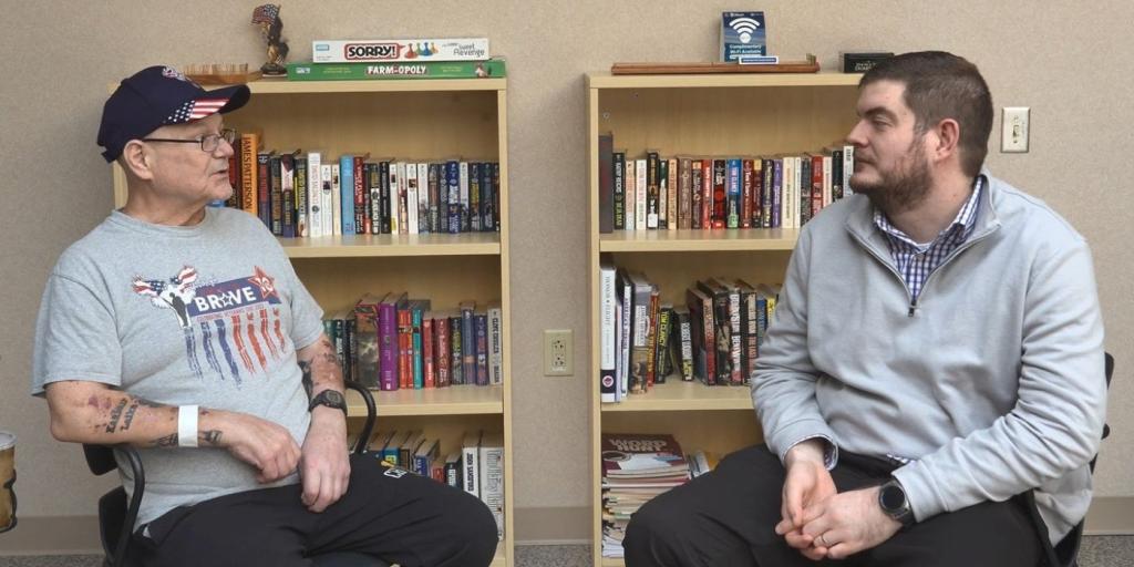 Veteran and trainee discussing care.  