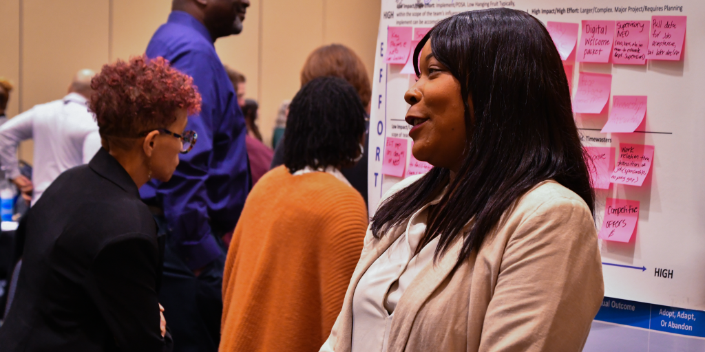 Cheryl Davis-Triplett MBA-HC, BSN, Interim Wilmington Health Care Center Administrator speaks to a crowd of people.