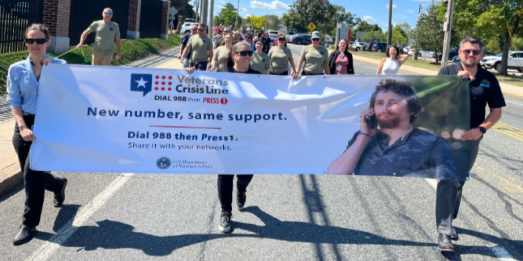 VA Providence staff and Veterans march down Chalkstone Avenue to support Veteran Suicide Prevention.