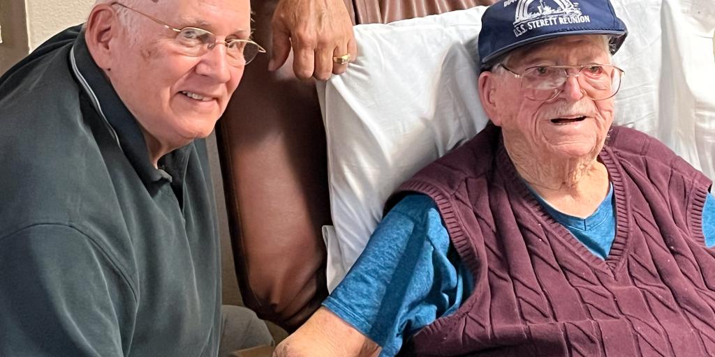 A 100-year-old WWII Veteran and former USS Sterett sailor, shares stories with Steve LeFebvre whose father also served aboard the ship during WWII. 