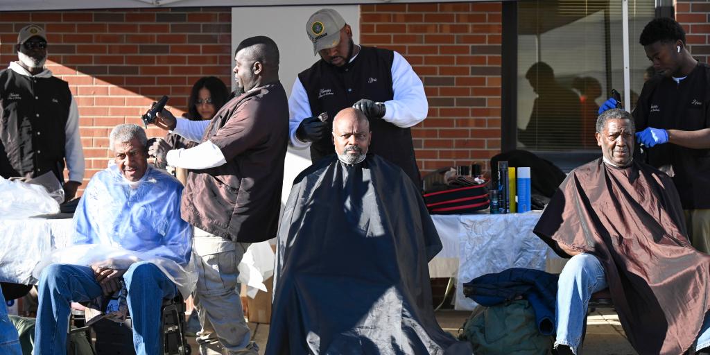 Barbers from the Neecie's College of Barbering provide free haircuts to Veterans during the Columbia VAHCS Homeless Veteran Stand Down, Oct. 23.