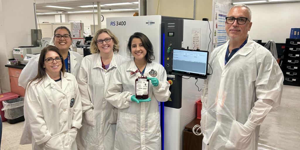 Blood bank technologists at the Malcolm Randall VAMC in Gainesville, Fla., celebrate the arrival of a new blood product irradiator.