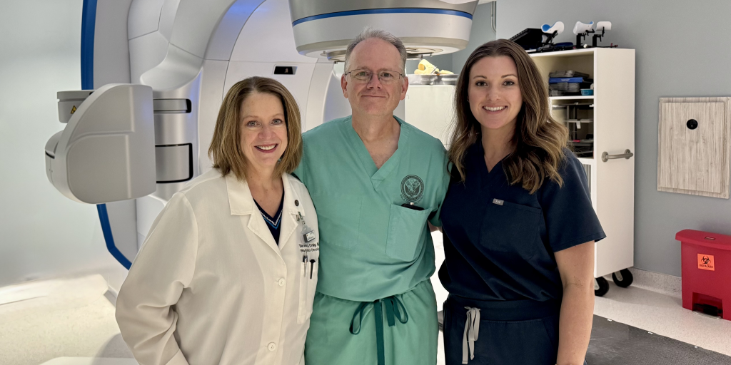 Veteran patient and VA physician assistant Mark Denney with his radiation oncology team after receiving cancer care at VA.