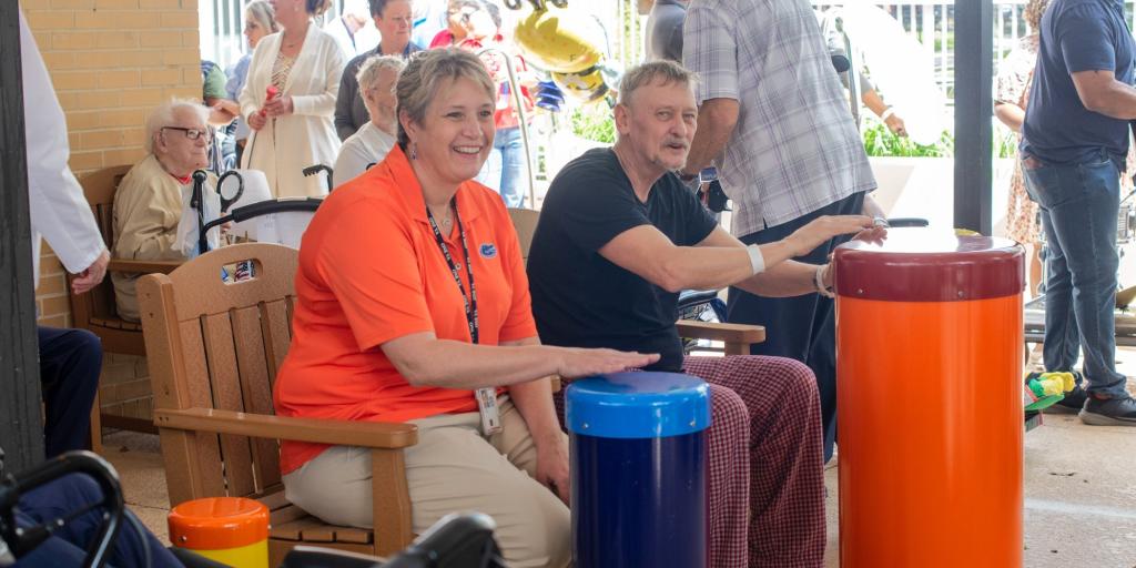 Veteran shares a musical moment with Wende Dottor at the Jeffery Clark Sound Garden in Lake City VA’s Dementia Specialty Care Unit. 