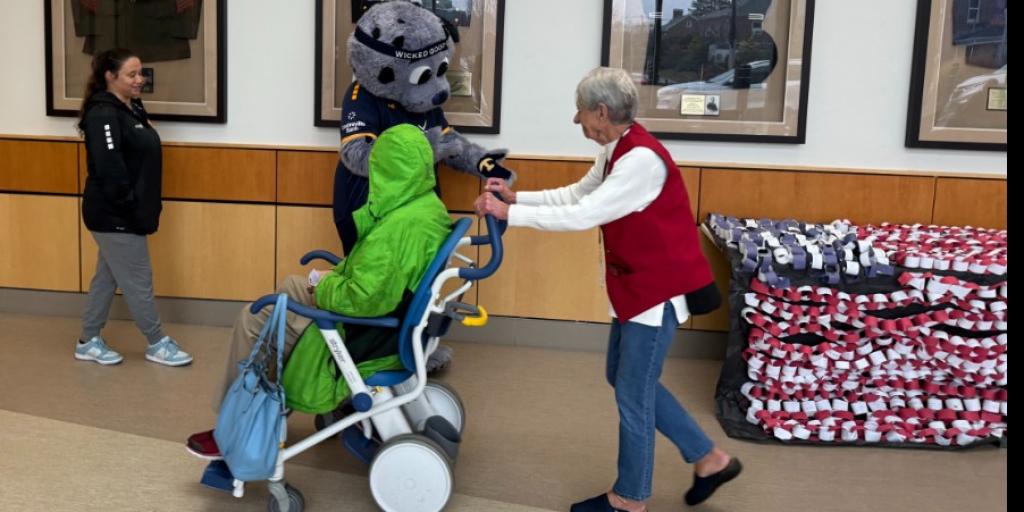 Rhode Island Football Club's "Chip" interacts with VA Providence Veterans and Staff during his visit.