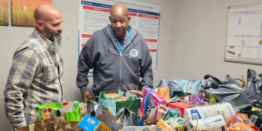 VA Providence's Kevin Price and Elks Member Matt Vianna with food donations to the homeless clinic.