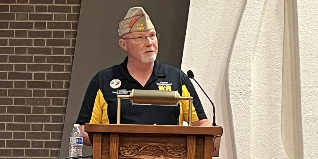 Man speaking at podium