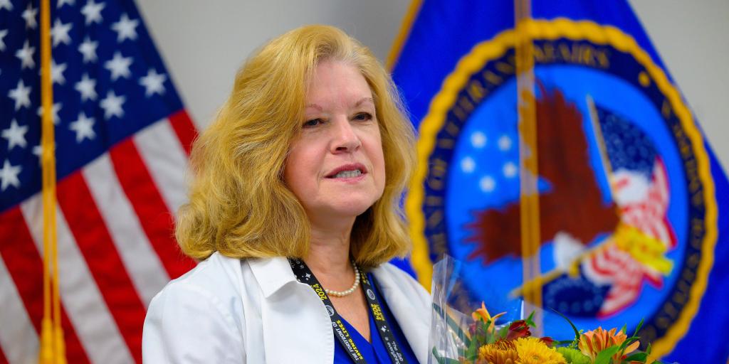Darlene Giles receives flowers during a retirement ceremony, Oct. 31, in the Director's Conference Room at the Wm. Jennings Bryan Dorn VAMC.