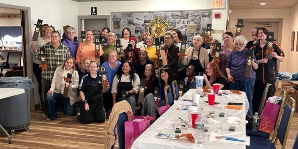 Women Warriors pose with their handmade crafts.
