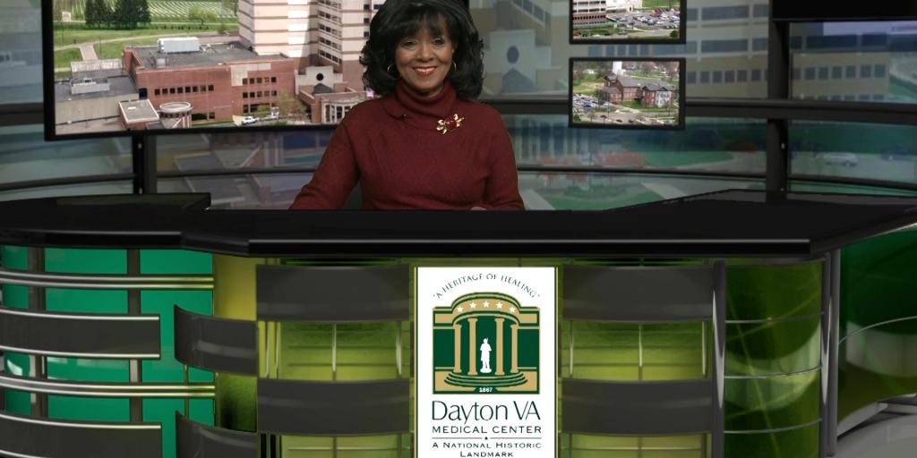 Public Affairs Officer Rhonda Moore at the Good News Report desk.