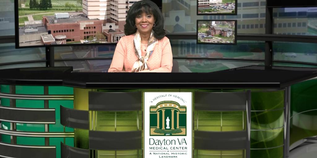 Public Affairs Officer Rhonda Moore at the Good News Report desk.